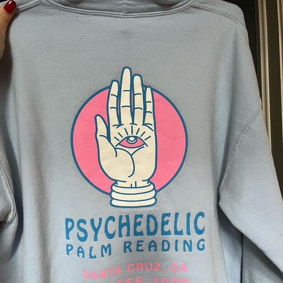 Psychedelic baby blue hoodie with pink writing - Picture 2 of 3